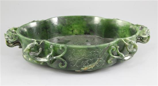 A large Chinese spinach green jade quatre-lobed bowl, Qianlong mark, width 37cm